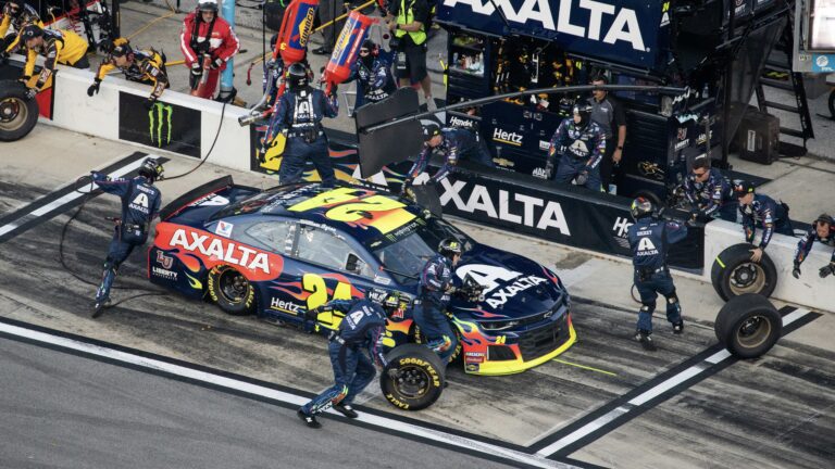 Car making a pit stop at a NASCAR event