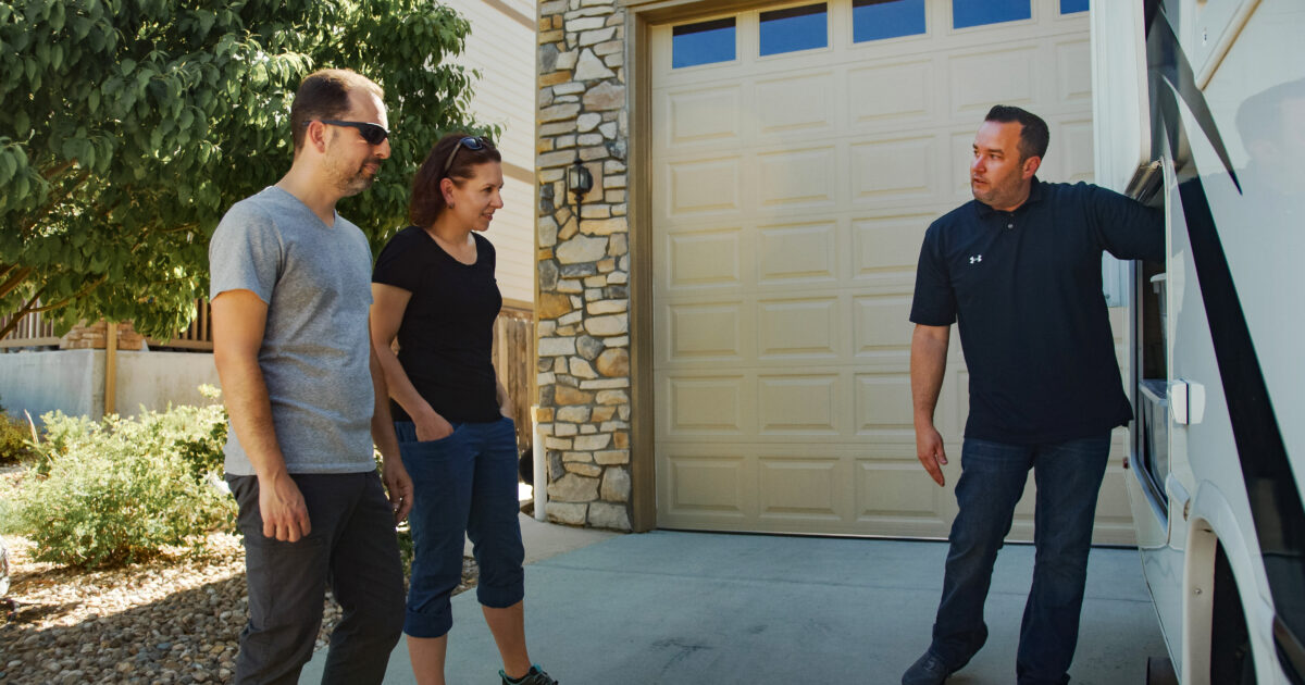 an owner showing guests his RV