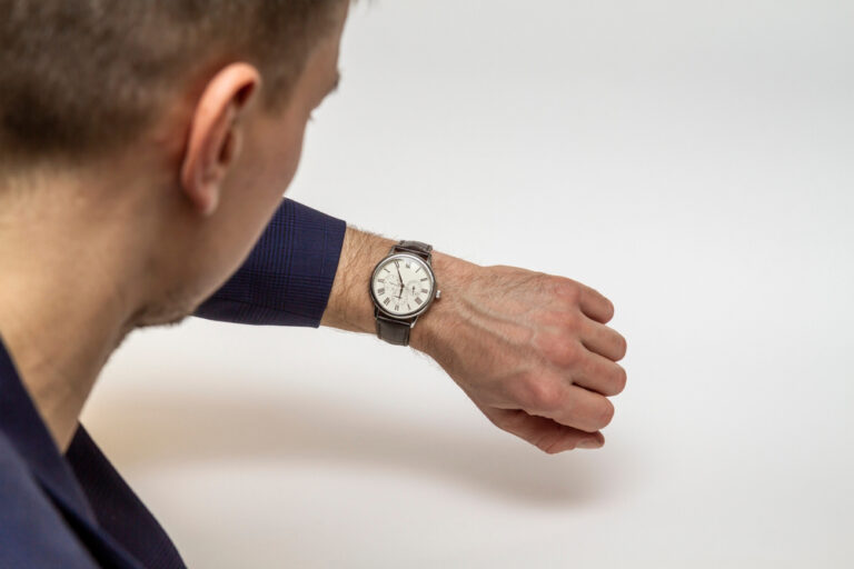 a man looking at his watch