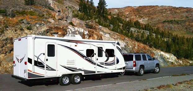 Travel trailer being towed on road trip