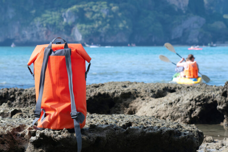 dry bag next to a lake