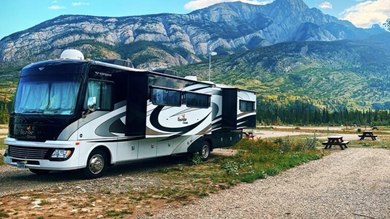 Motorhome sitting in front of a mountain