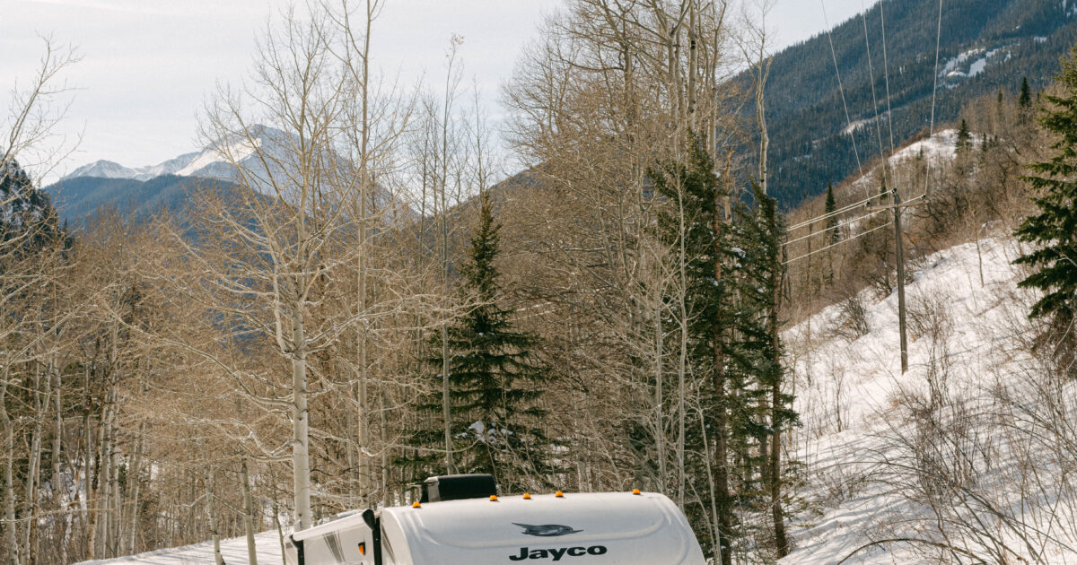 An RV parked in the snow