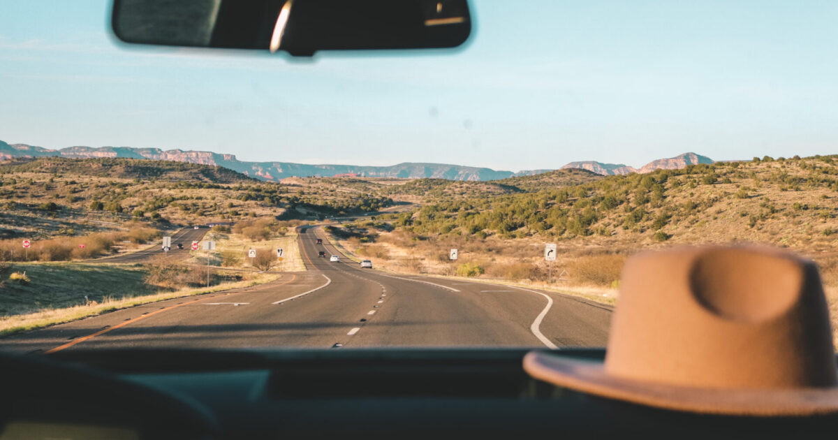 a camper driving down a road