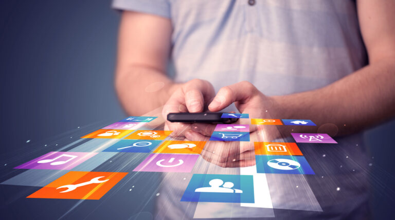 a man holding a phone with apps