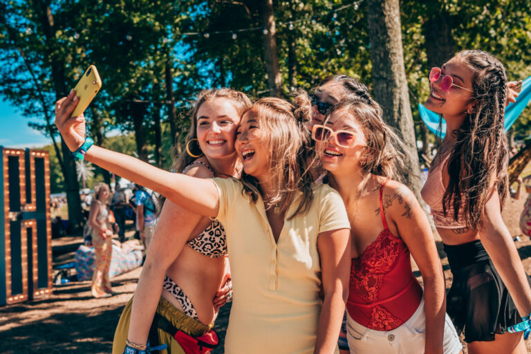 girls taking a selfie at a festival