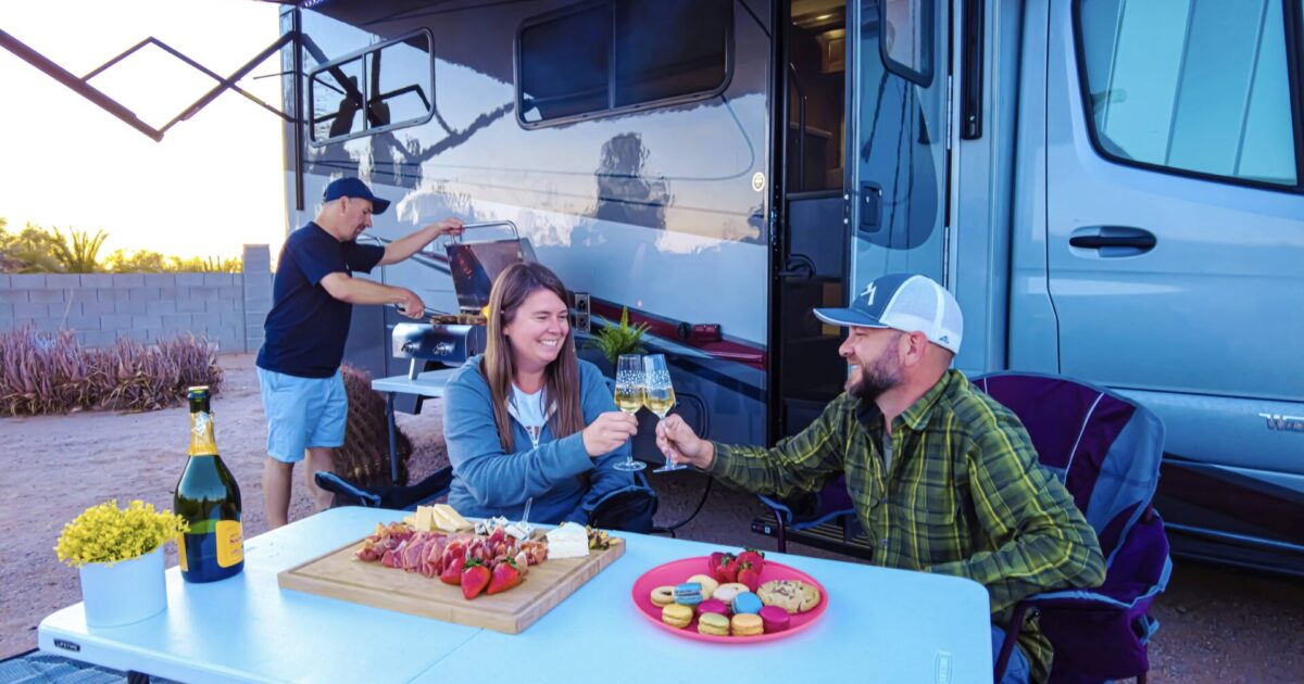 Friends hanging out under RV awning
