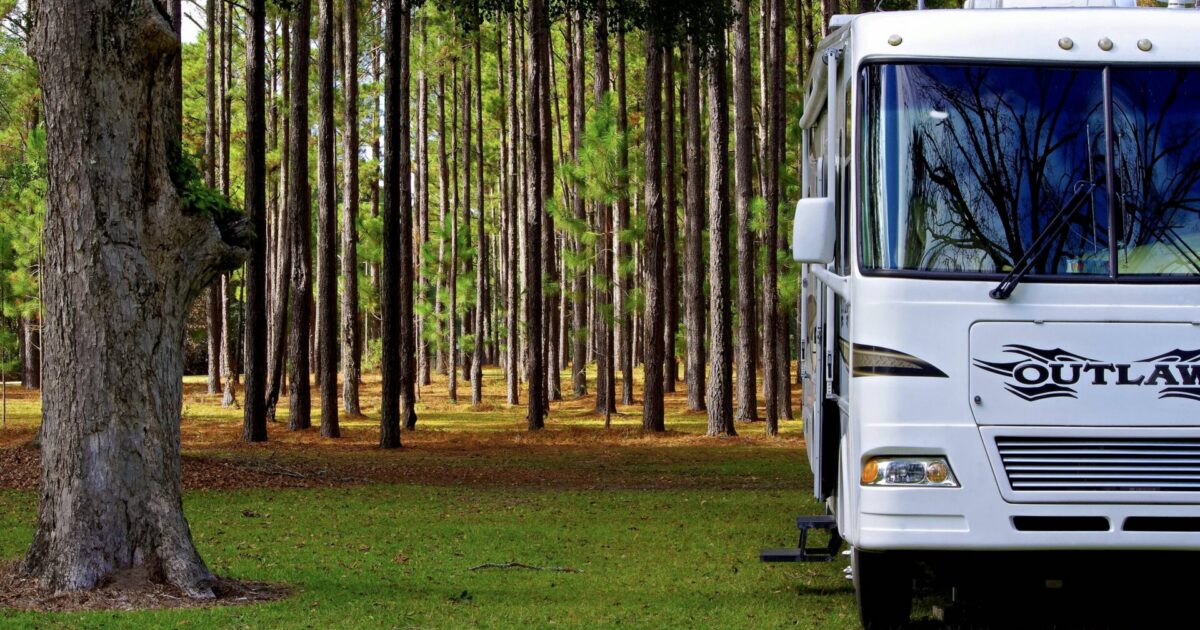 RV parked in the woods