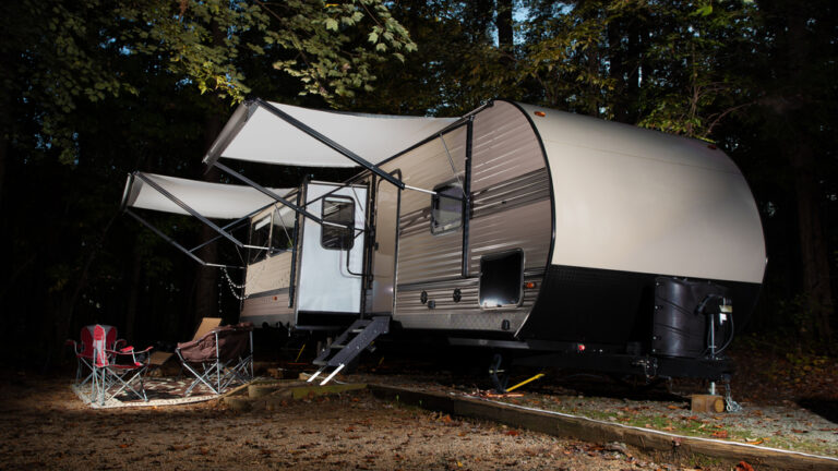 A trailer with two awnings set up
