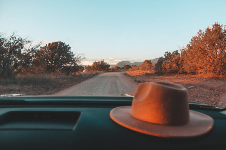 A felt hat on the dashboard of an RV