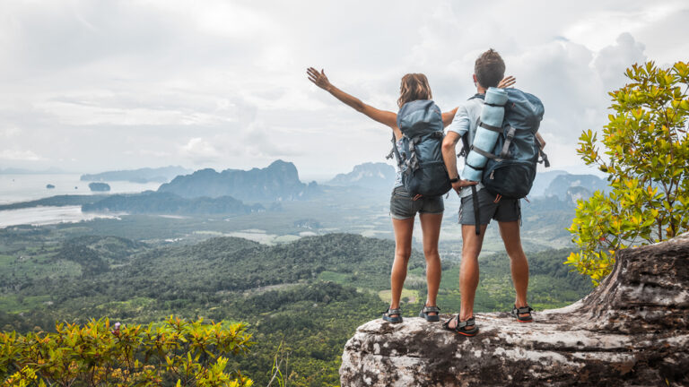hikers looking at a scenic mountain view