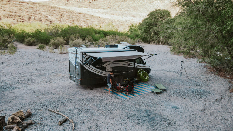 An RV set up with a sunshade