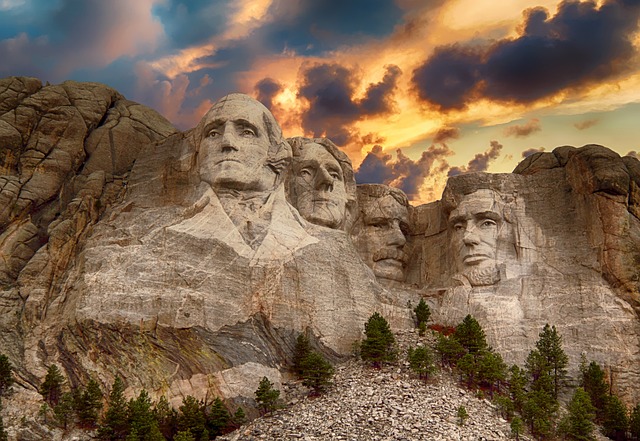 The sun setting dramatically behind Mt Rushmore