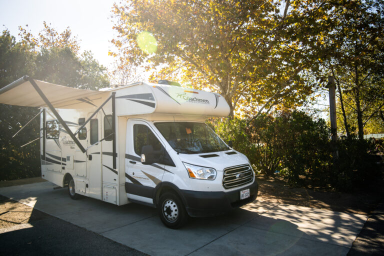 An RV set up with an awning open