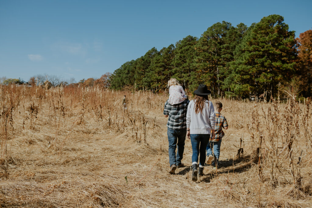 family in corn maze enjoying fall activity