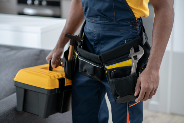 A man holding a toolbox