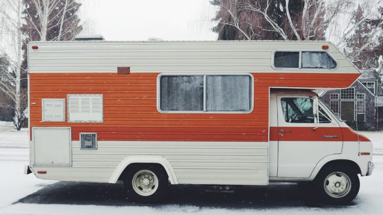 RV parked on road in winter