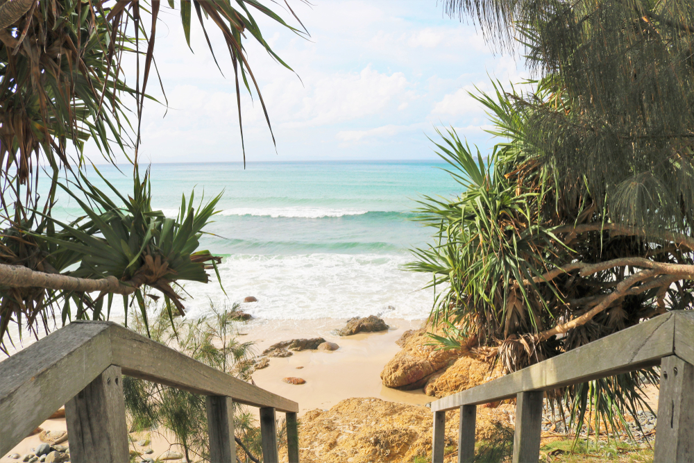 stairs leading down to a beach