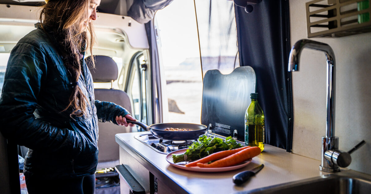 woman cooking in an rv