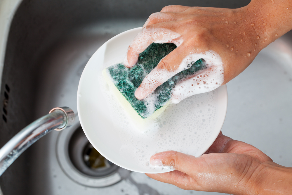 A person washing dishes