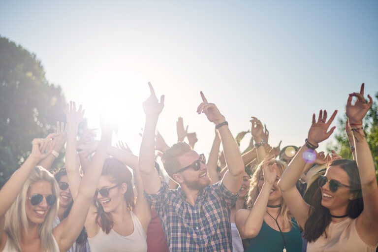 people dancing at an outdoor festival