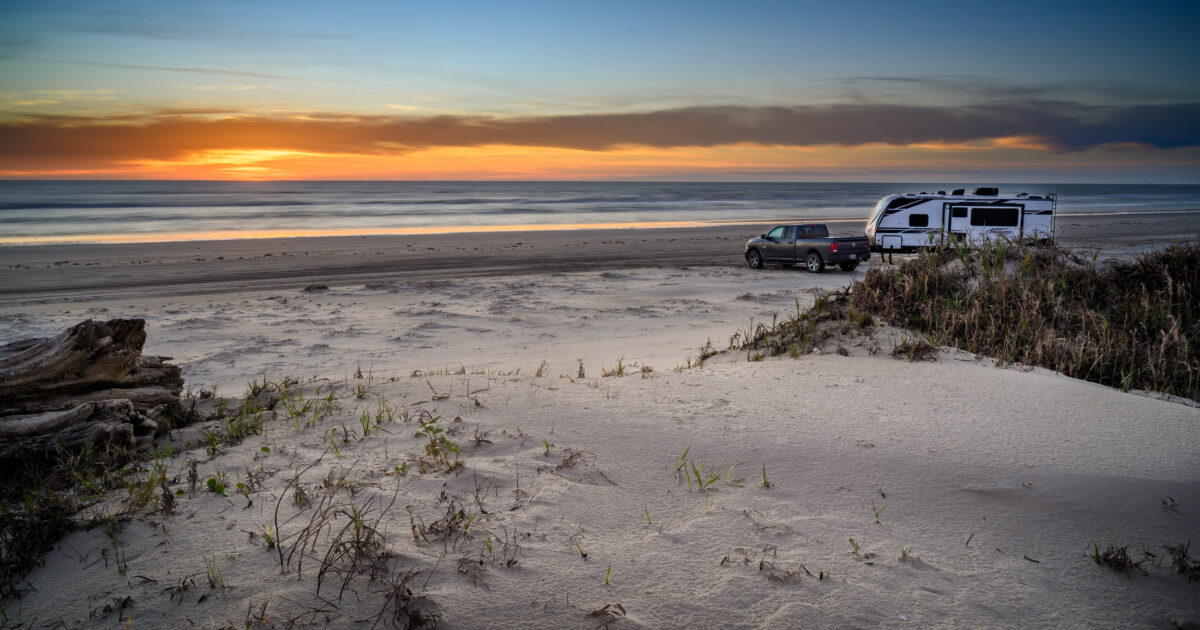 rv parked on a beach in south padre island, tx
