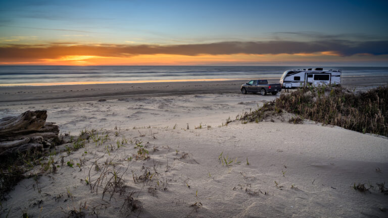 rv parked on a beach in south padre island, tx