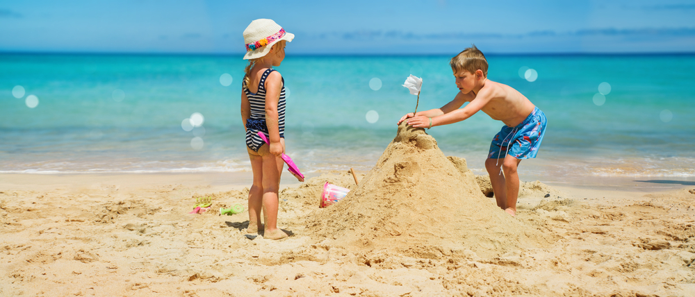 kids building a sand castle