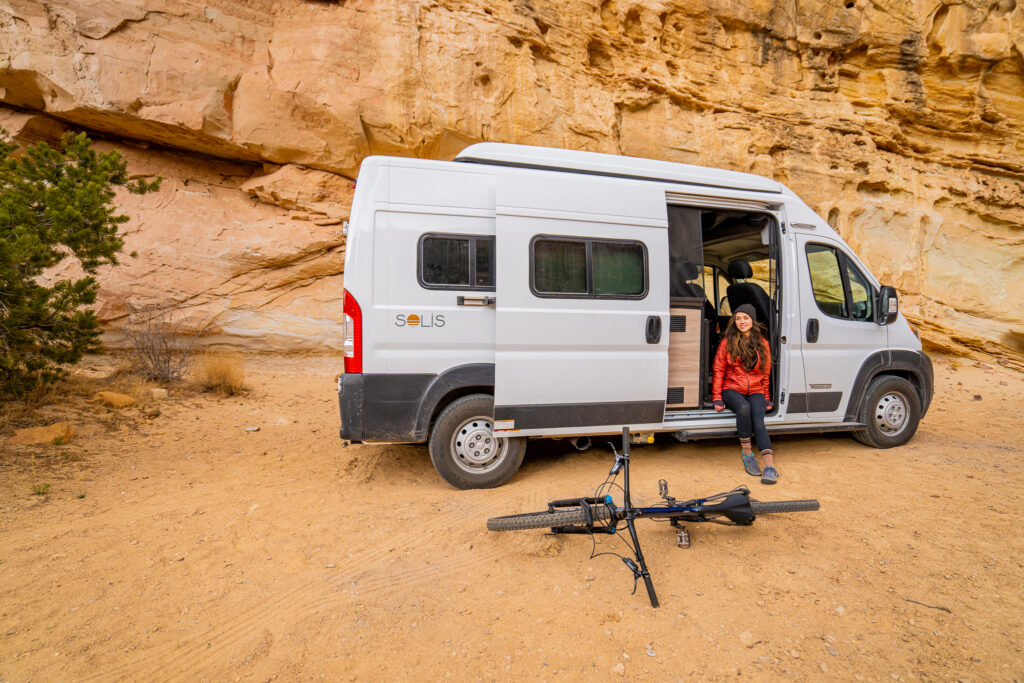 A Campervan with a bike in front of it