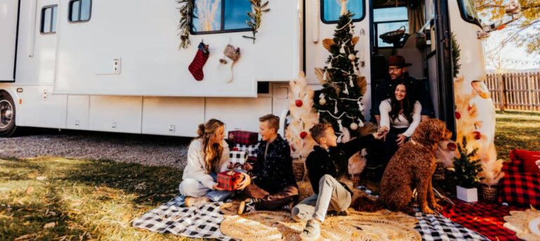 A family doing holiday RV travel and decorating their rig