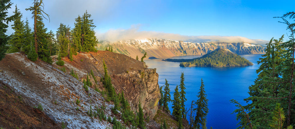 Crater Lake National Park with sun on the far mountains