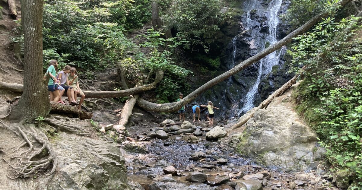 Kids playing in waterfall in Great Smoky Mountains National Park