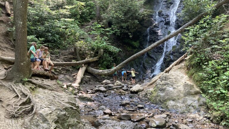 Kids playing in waterfall in Great Smoky Mountains National Park