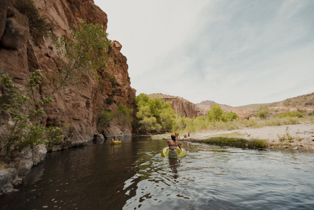 people tubing in a river