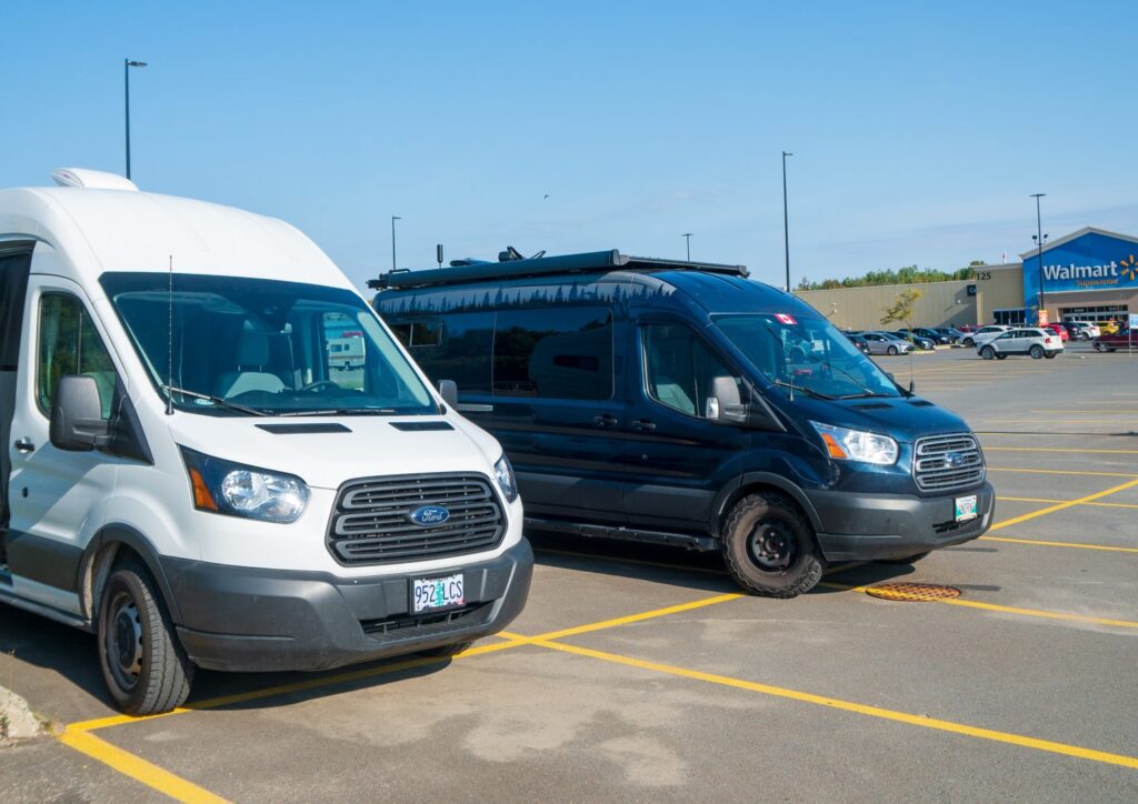 two RV campervan parking for free overnight at a walmart