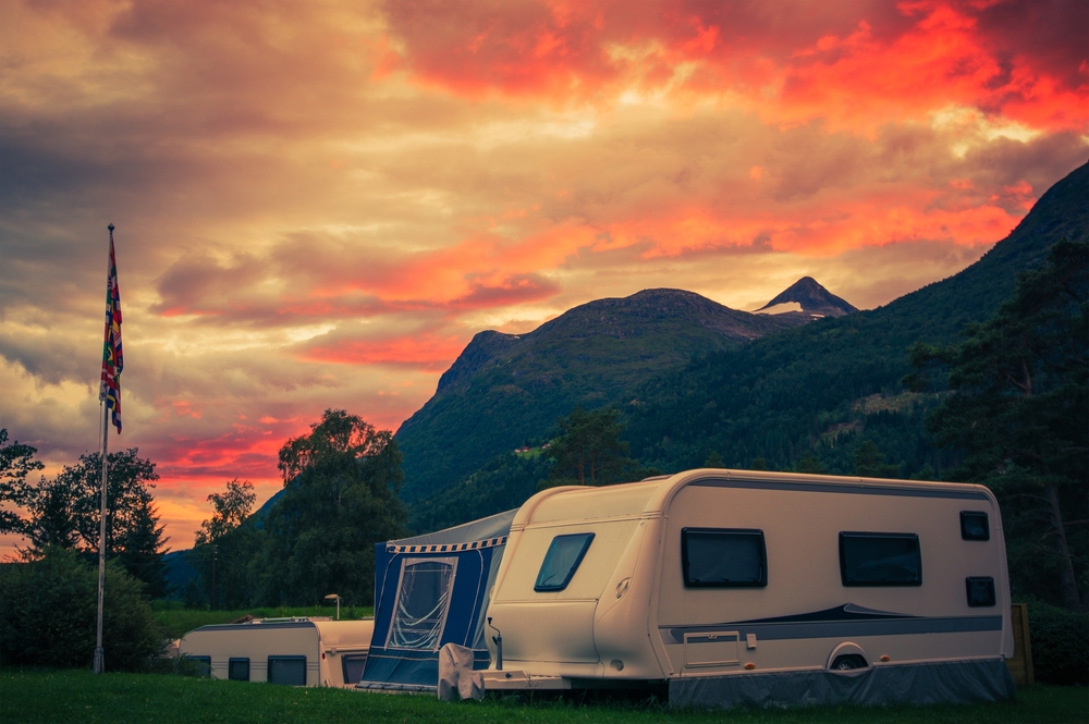 an RV awning screen room next to a trailer