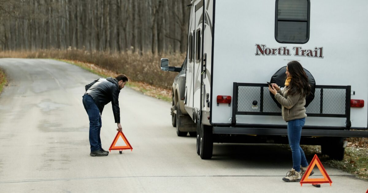 People on the side of the road calling RV warranty company