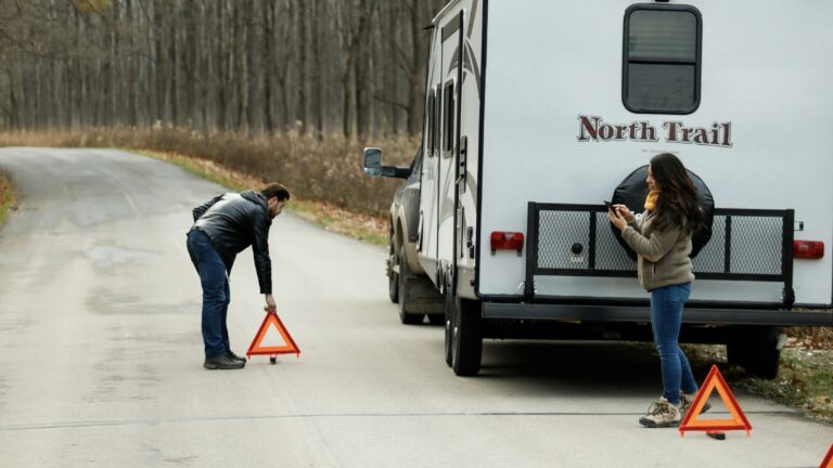 People on the side of the road calling RV warranty company
