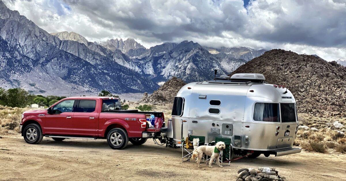 RV towing: truck towing a trailer to a boondocking spot
