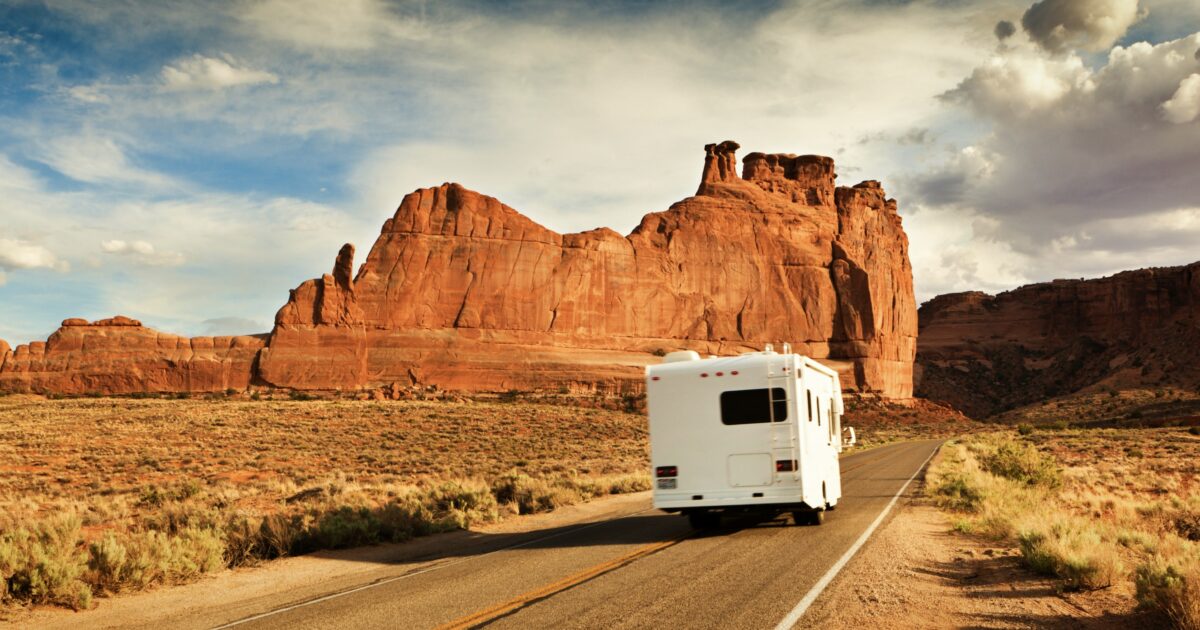 RV driving near cool rock formations, a great RVing for beginners destination