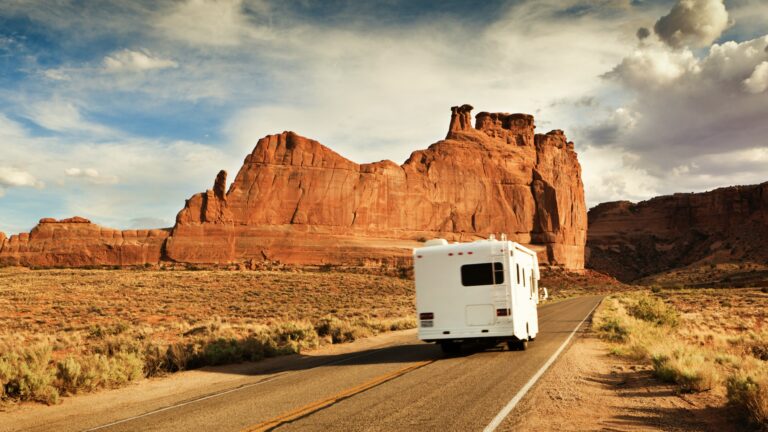 RV driving near cool rock formations, a great RVing for beginners destination