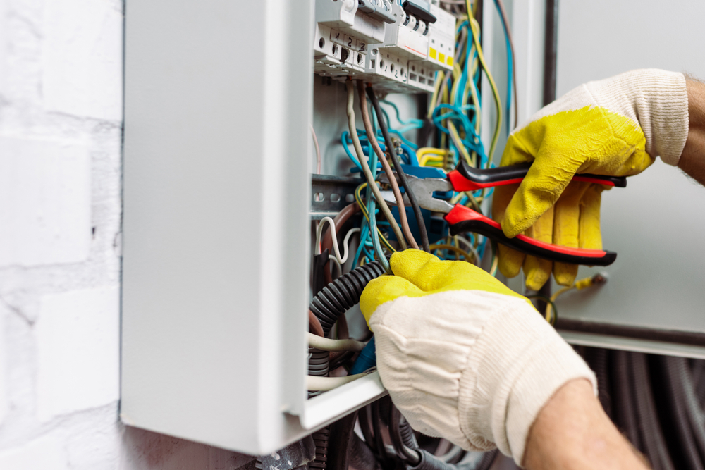 an electrician working on wires