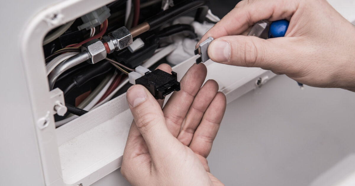 Man working on RV electrical system