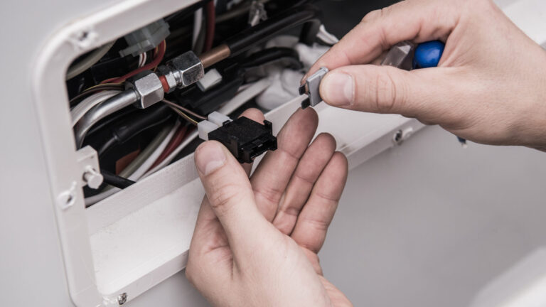 Man working on RV electrical system
