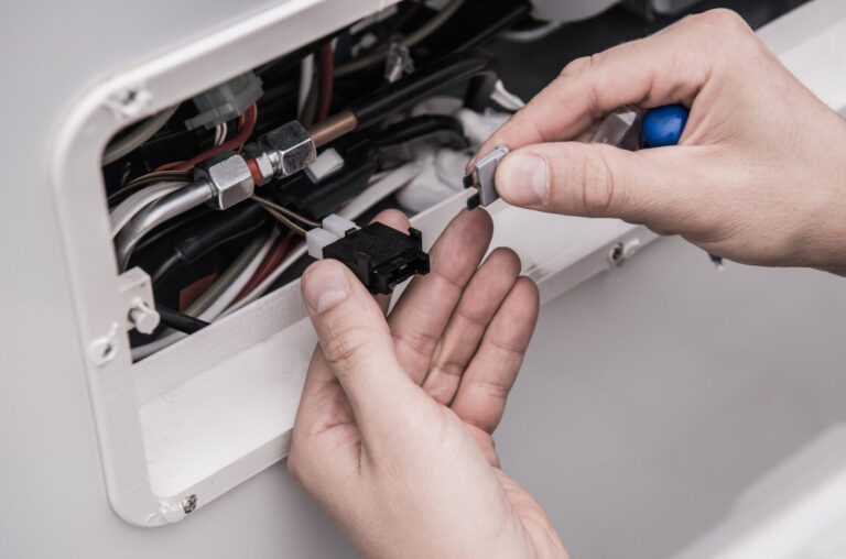 Man working on RV electrical system