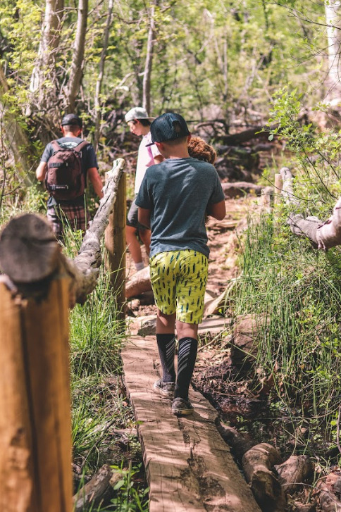 kids hiking on a trail