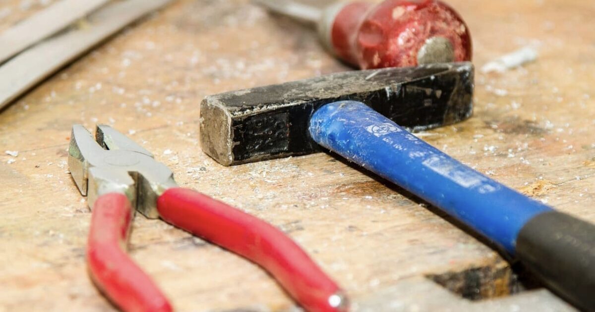 Tolls for RV floor replacement laying on wood subfloor