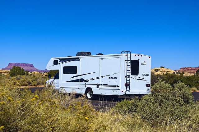 RV with exterior ladder in desert