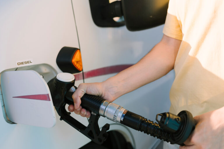 man filling his rv with diesel fuel