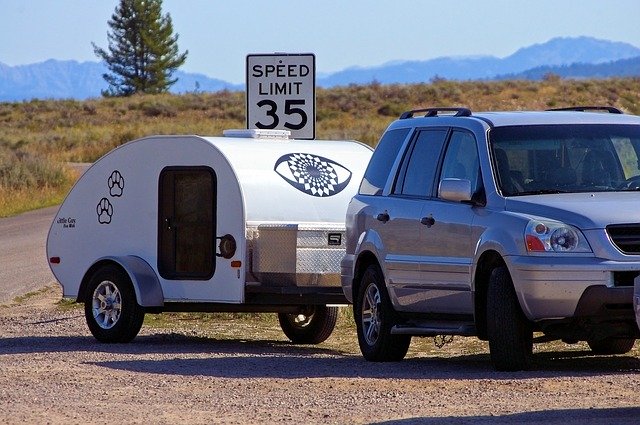 teardrop trailer being towed down a road